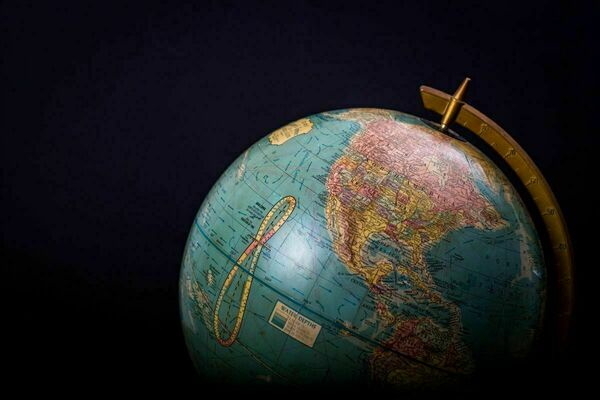 Antique globe against a black background.